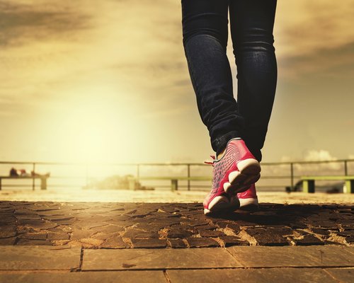 Comfortable walking shoes on a pavement