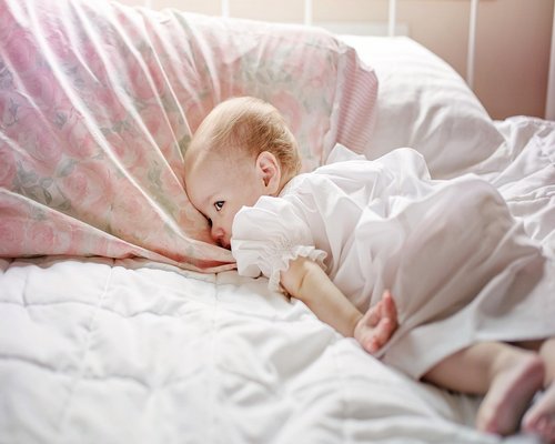 A person sleeping peacefully in a comfortable bed