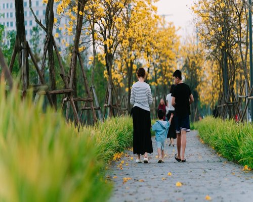 A family taking a slow walk in a park