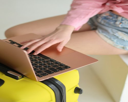 A person typing on a laptop