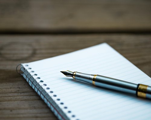 Close up of writing notes on paper
